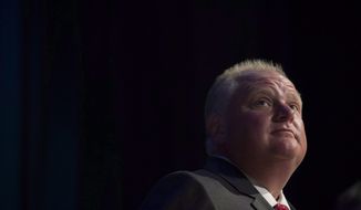 In a July 15, 2014, file photo, Toronto Mayor Rob Ford pauses while participating in a mayoral debate in Toronto.  (AP Photo/The Canadian Press, Darren Calabrese, file)