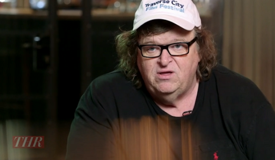 Michael Moore took to Facebook Monday morning to celebrate the Supreme Court&#39;s ruling on gay marriage and blast white conservatives as ignorant and hateful. (The Hollywood Reporter) ** FILE **