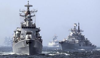 In this May 24, 2014 photo, China&#39;s Harbin (112) guided missile destroyer, left, and DDG-139 Ningbo Sovremenny class Type-956EM destroyer, right, take part in a week-long China-Russia &amp;quot;Joint Sea-2014&amp;quot; navy exercise at the East China Sea off Shanghai, China. (AP Photo)