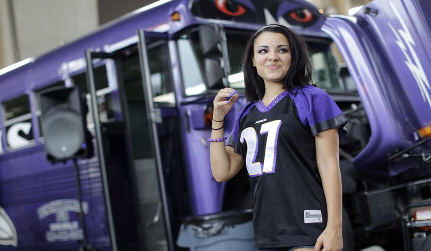 Racquel Bailey wears a Ray Rice jersey as she tailgates before the Baltimore Ravens&#39; NFL football game against the Pittsburgh Steelers on Thursday, Sept. 11, 2014, in Baltimore. (AP Photo/Patrick Semansky)