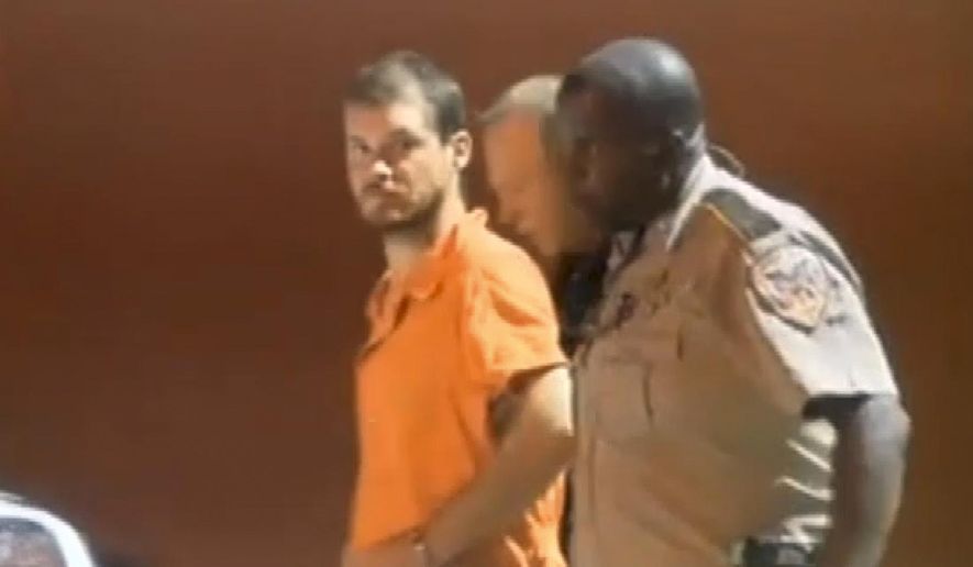 In this image taken from video on Tuesday, Sept. 9, 2014, Smith County Sheriff's Deputies escort Timothy Ray Jones Jr., from jail in Raleigh, Miss. Jones, of Lexington County, S.C., is expected to be extradited back to South Carolina on Wednesday, Sept. 10, 2014, and charged with murder in the deaths of his five children after he led authorities to a secluded clearing in Alabama on Tuesday, where their bodies were found wrapped in garbage bags. (AP Photo/WLBT, Tegre Taylor) JACKSON, MISS., OUT: LOCAL TV OUT: LOCAL ONLINE OUT: LOCAL MEDIA OUT: MANDATORY CREDIT.