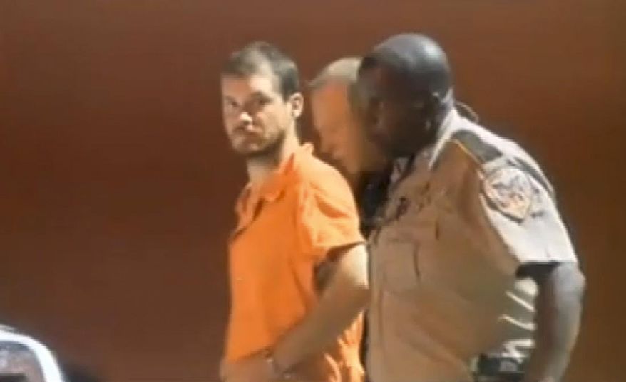 In this image taken from video on Tuesday, Sept. 9, 2014, Smith County Sheriff's Deputies escort Timothy Ray Jones Jr., from jail in Raleigh, Miss. Jones, of Lexington County, S.C., is expected to be extradited back to South Carolina on Wednesday, Sept. 10, 2014, and charged with murder in the deaths of his five children after he led authorities to a secluded clearing in Alabama on Tuesday, where their bodies were found wrapped in garbage bags. (AP Photo/WLBT, Tegre Taylor) JACKSON, MISS., OUT: LOCAL TV OUT: LOCAL ONLINE OUT: LOCAL MEDIA OUT: MANDATORY CREDIT.