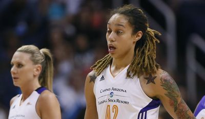 Phoenix Mercury center Brittney Griner (42) walks to the bench after getting a cut above her eye during the first half of  Game 2 of the WNBA basketball finals against the Chicago Sky, Tuesday, Sept. 9, 2014, in Phoenix. (AP Photo/Matt York)