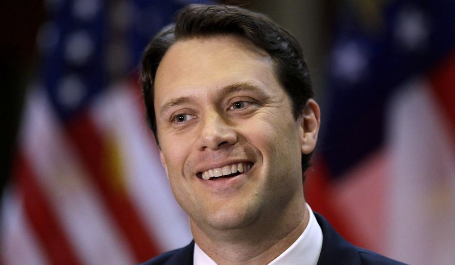 In this Nov. 7, 2013 file photo, Georgia State Sen. Jason Carter (D-Decatur), the grandson of former President Jimmy Carter., announces he has filed paperwork to run for governor during a news conference in Atlanta. Carter, a 39-year-old state senator is using multiple ethics investigations going back to Gov. Nathan Deal’s tenure as a congressman to cast the governor as a politician who serially abuses public office for his own benefit. (AP Photo/John Bazemore, File)