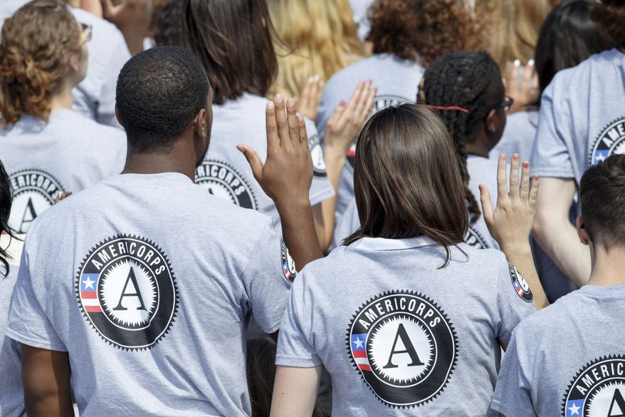 Hundreds of new volunteers are sworn in for duty at a ceremony marking the 20th anniversary of the AmeriCorps national service program on the South Lawn of the White House on Sept. 12. (AP Photo/J. Scott Applewhite)