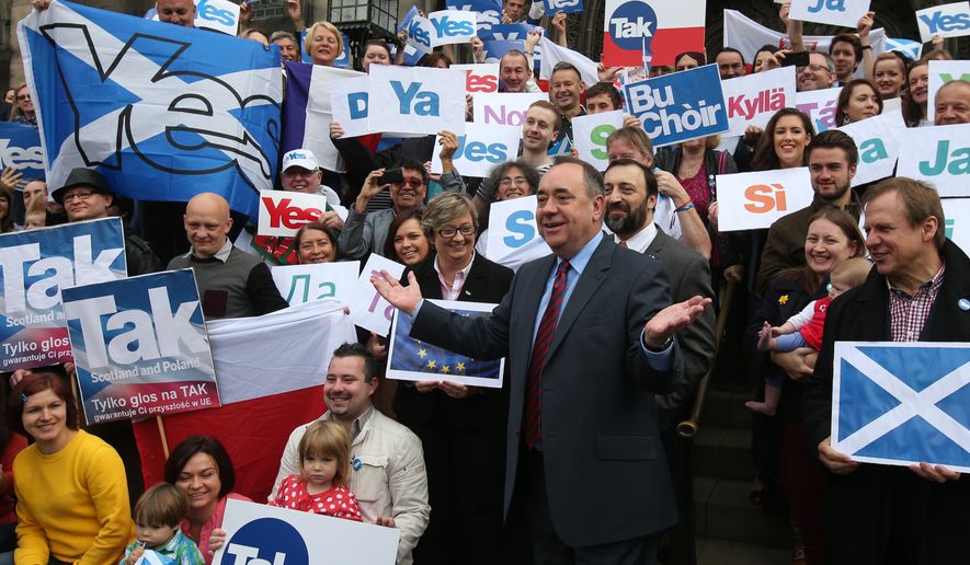 In this photo taken on Tuesday, Sept. 9, 2014, Scottish First Minister Alex Salmond meets with Scots and other European citizens to celebrate European citizenship and &quot;Scotland&#39;s continued EU membership with a Yes vote&quot; at  Parliament Square in Edinburgh. (AP Photo/PA, Andrew Milligan) UNITED KINGDOM OUT, NO SALES, NO ARCHIVE