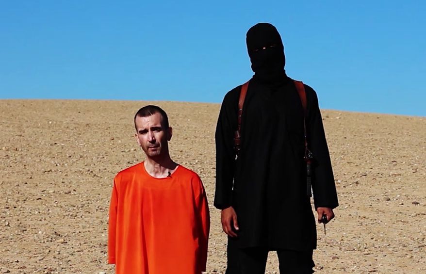 This image made from video posted on the Internet by Islamic State militants and provided by the SITE Intelligence Group, a U.S. terrorism watchdog, on Saturday, Sept. 13, 2014, purports to show British aid worker David Haines before he was beheaded. (Associated Press)