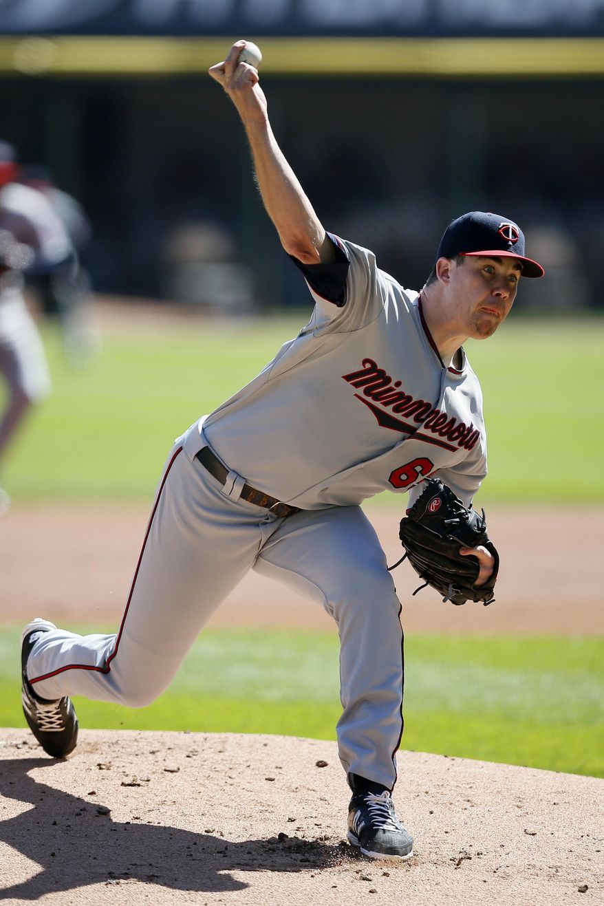 Minnesota Twins starting pitcher Trevor May delivers against the Chicago White Sox during the first inning of a baseball game Sunday, Sept. 14, 2014, in Chicago. (AP Photo/Andrew A. Nelles)