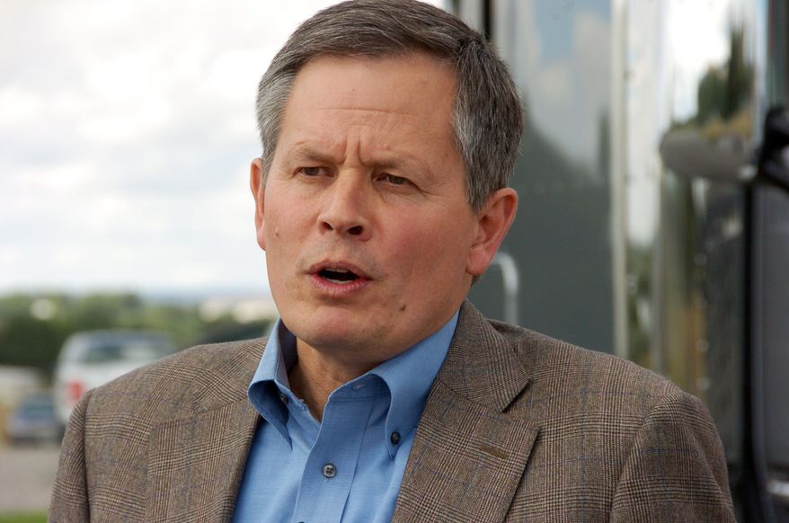 This Monday, Aug. 25, 2014, file photo U.S. Rep. Steve Daines, a first-term Montana Republican seeking election to the U.S. Senate, talks to media in Billings. (AP Photo/Matthew Brown) ** FILE **