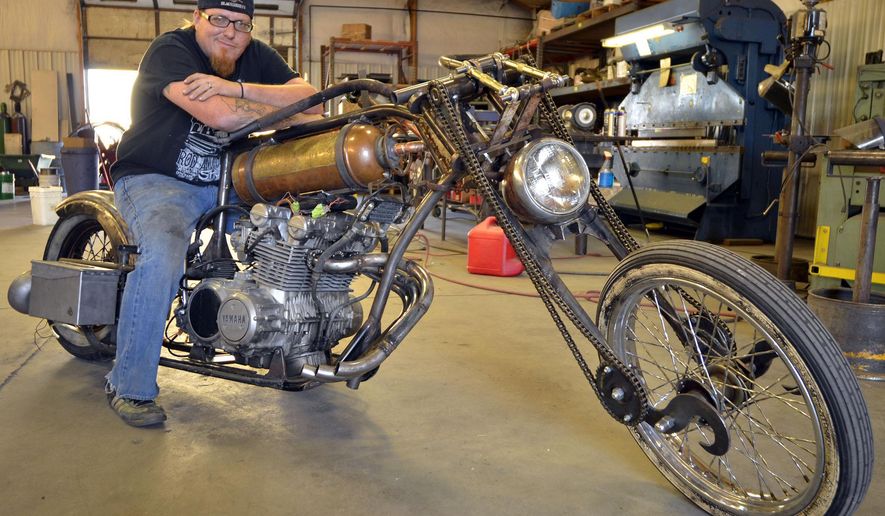 GardnerRoad Kustoms Owner, Jeremiah Gardner is photographed on Sept. 2, 2013 in Mitchell, Neb. Gardner has been hard at work the past few weeks building a one-of-a-kind motorcycle that will be entered into the Rat.Hard Build-Off/Drive-Off Bike Team competition for a change to be featured in the Ride Hard motorcycle magazine. (AP Photo/The Star-Herald, Joe Dutton)