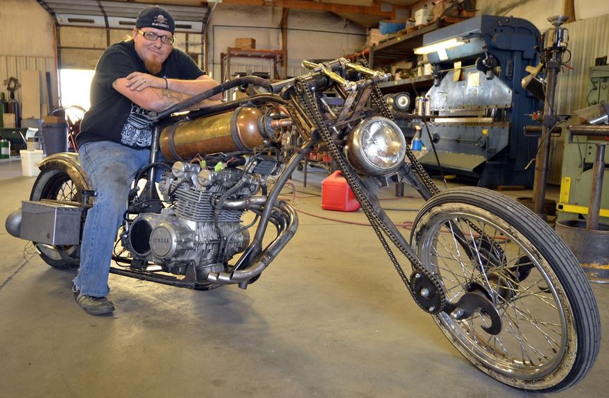 GardnerRoad Kustoms Owner, Jeremiah Gardner is photographed on Sept. 2, 2013 in Mitchell, Neb. Gardner has been hard at work the past few weeks building a one-of-a-kind motorcycle that will be entered into the Rat.Hard Build-Off/Drive-Off Bike Team competition for a change to be featured in the Ride Hard motorcycle magazine. (AP Photo/The Star-Herald, Joe Dutton)