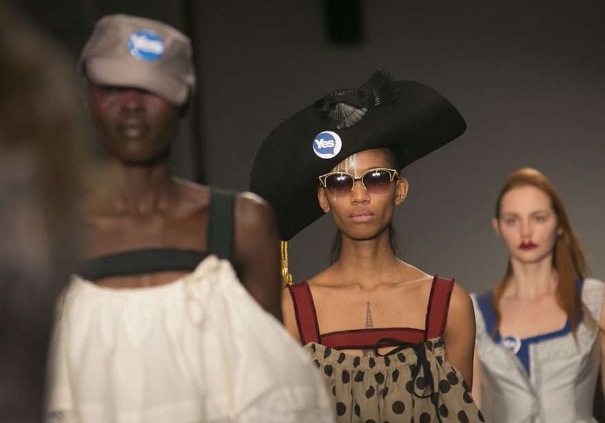 A model wears an outfit by designer Vivienne Westwood for the Spring/Summer 2015 collection during London Fashion Week, at Victoria House in central London, Sunday, Sept. 14, 2014. (Photo by Joel Ryan/Invision/AP)