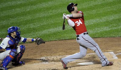 Washington Nationals&#x27; Bryce Harper (34) hits a two-run home run off of New York Mets starting pitcher Zack Wheeler as Travis d&#x27;Arnaud catches for the Mets in the  second inning of a baseball game at Citi Field on Saturday, Sept. 13, 2014, in New York. (AP Photo/Kathy Kmonicek)