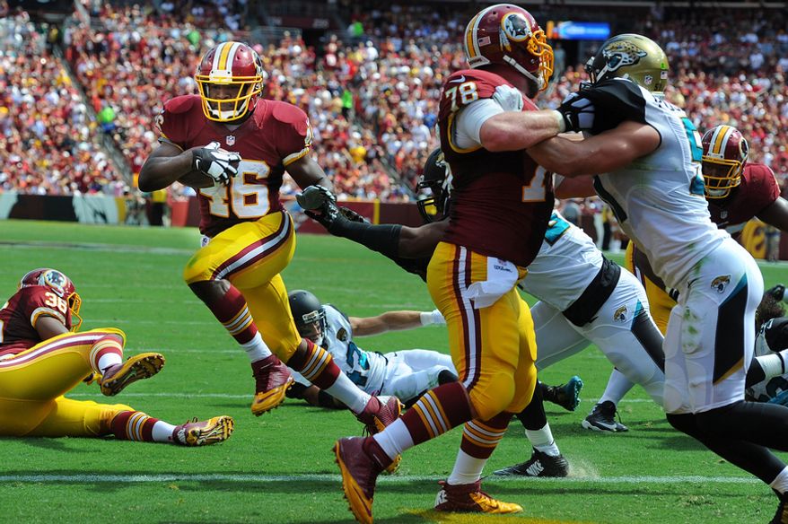 Washington Redskins running back Alfred Morris (46) rushes into the end zone behind the blocking of center Kory Lichtensteiger (78) for a second quarter touchdown against the Jacksonville Jaguars at FedEx Field, Sept. 14, 2014. (Preston Keres/Special for The Washington Times)