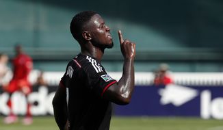 **FILE** D.C. United forward Eddie Johnson (7) celebrates after his goal during the second half of an MLS soccer match against the New York Red Bulls on Sunday, Aug. 31, 2014, in Washington. United won 2-0. (AP Photo/Alex Brandon)