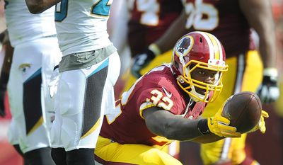 Washington Redskins running back Silas Redd (32) celebrates a first down run against the Jacksonville Jaguars at FedEx Field, Sept. 14, 2014. (Preston Keres/Special for The Washington Times)