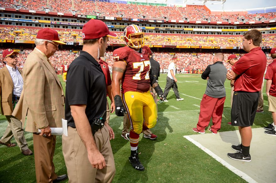 Washington Redskins guard Shawn Lauvao (77) comes off the field after being injured as the Washington Redskins play the Jacksonville Jaguars at FedExField, Landover, Md., Monday, September 9, 2013. (Andrew Harnik/The Washington Times)