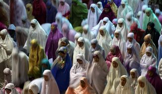 Muslim women perform an evening prayer called &#39;tarawih&#39; marking the first eve of the holy fasting month of Ramadan n Jakarta, Indonesia in June. Fears about the threat posed by the Islamic State are mounting not only in the West but also in the capital of the world&#39;s most populous Muslim nation. (AP Photo/Tatan Syuflana)