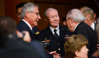 Secretary of Defense Chuck Hagel, left, and the Chairman of the Joint Chiefs of Staff Martin Dempsey, center, speak with Chairman Carl Levin, right, before they testify concerning the Islamic State of Iraq and the Levant (ISIL) in front of the Senate Armed Services Committee on Capitol Hill, Washington, D.C., Tuesday, September 16, 2014. (Andrew Harnik/The Washington Times)
