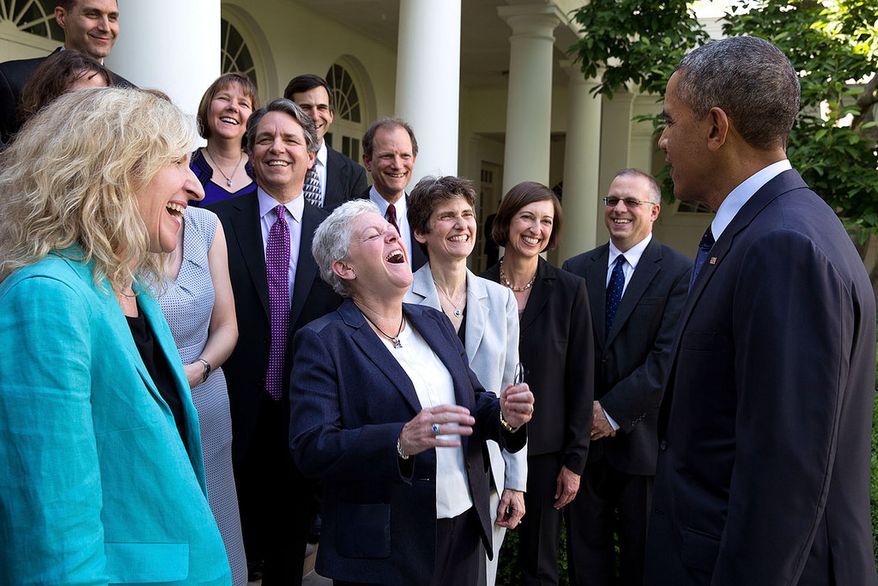 President Barack Obama jokes with Environmental Protection Agency Administrator Gina McCarthy and EPA staff members who worked on the power plant emissions standards, in the Rose Garden of the White House, June 2, 2014. (Official White House Photo by Pete Souza)