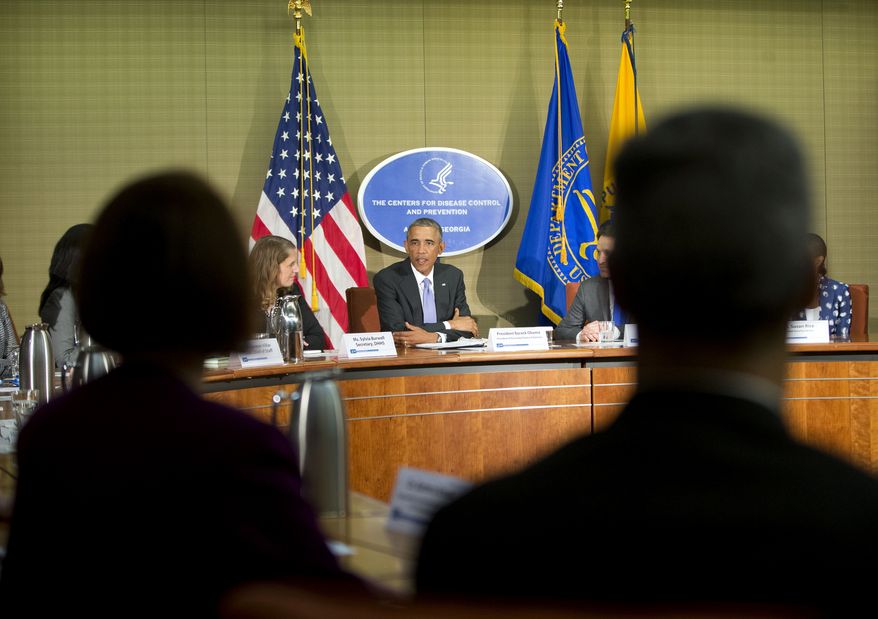President Barack Obama, center, and Secretary of Health and Human Services, Sylvia Mathews Burwell, left, meet with Emory University Doctors and healthcare professionals at the Centers for Disease Control and Prevention (CDC) in Atlanta, Tuesday, Sept. 16, 2014. Obama traveled to the CDC to address the Ebola crisis and announced that he is sending 3,000 American troops to West Africa nations fight the spread of the Ebola epidemic. (AP Photo/Pablo Martinez Monsivais)