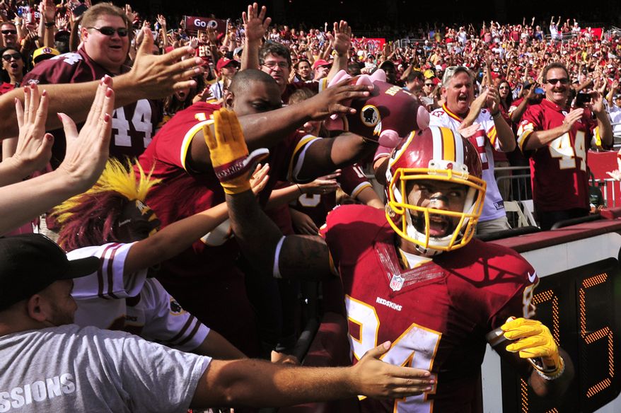 Washington Redskins tight end Niles Paul (84)  celebrates with the fans after his second touchdown reception of the day against the Jacksonville Jaguars at FedEx Field, Sept. 14, 2014. (Preston Keres/Special for The Washington Times)