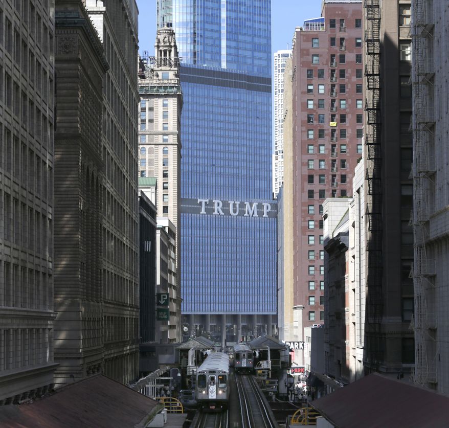 The Trump International Hotel and Tower is seen looking north on Wabash Ave. in Chicago's famed Loop Wednesday, Sept. 17, 2014. Chicago will always have the TRUMP sign on one of its tallest buildings to remind everyone in big, bold letters how Mayor Rahm Emanuel got trumped by The Donald, but now the mayor is proposing an ordinance to make sure nobody else can do the same. (AP Photo/Charles Rex Arbogast)