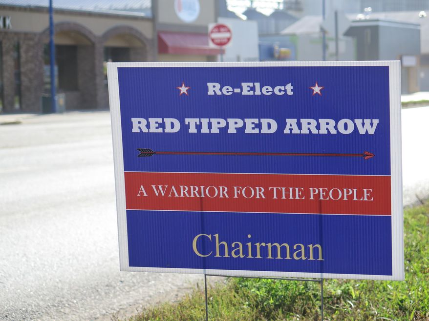 A sign urges people to vote for Tex Hall, whose native name is Red Tipped Arrow, in New Town, N.D. on Tuesday, Sept. 16, 2014.  Members of North Dakota&#39;s oil-rich Mandan, Hidatsa and Arikara Nations voted Tuesday in a primary election that will determine the two candidates who will vie for the leadership of the tribes in November. (AP Photo/Josh Wood)