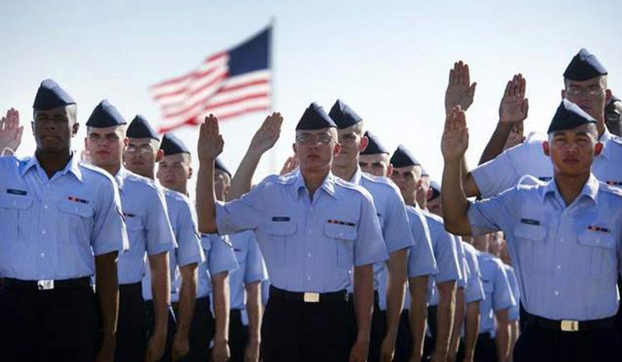 Airmen repeat the oath of enlistment at the Air Force Basic Training graduation ceremony, Lackland Air Force Base, Texas (U.S. Air Force, Staff Sgt Vernon Young Jr.)
