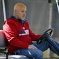Washington Nationals general manager Mike Rizzo watches during a spring training baseball workout, Monday, Feb. 17, 2014, in Viera, Fla. (AP Photo/Alex Brandon)