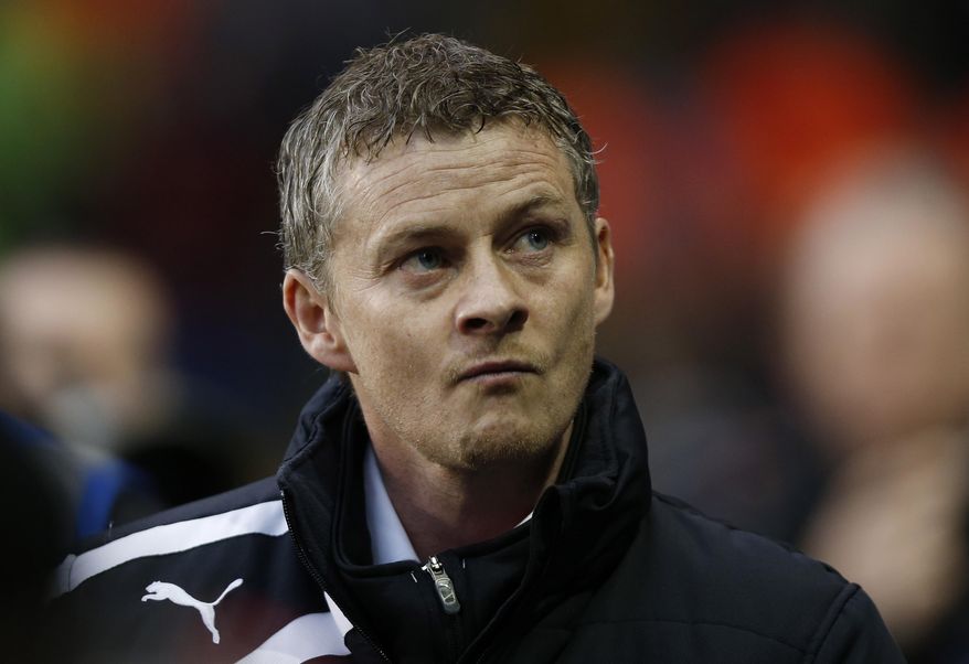 FILE - In this Sunday, March 2, 2014 file photo, Cardiff City's manager Ole Gunnar Solskjaer looks on from the dugout before the start of their English Premier League soccer match against Tottenham Hotspur at White Hart Lane, London. Ole Gunnar Solskjaer has left his position as Cardiff manager, ending the former Manchester United striker's first coaching job in British football after nine months. Cardiff, which was relegated from the English Premier League under Solskjaer last season, says in a statement released Thursday that the Norwegian coach has "stepped down ... with immediate effect following recent discussions." The Welsh club has lost three of its first seven games in the second-tier League Championship. Cardiff owner Vincent Tan says "regrettably our recent results do not justify Ole's continued role as manager at Cardiff." (AP Photo/Sang Tan, file)