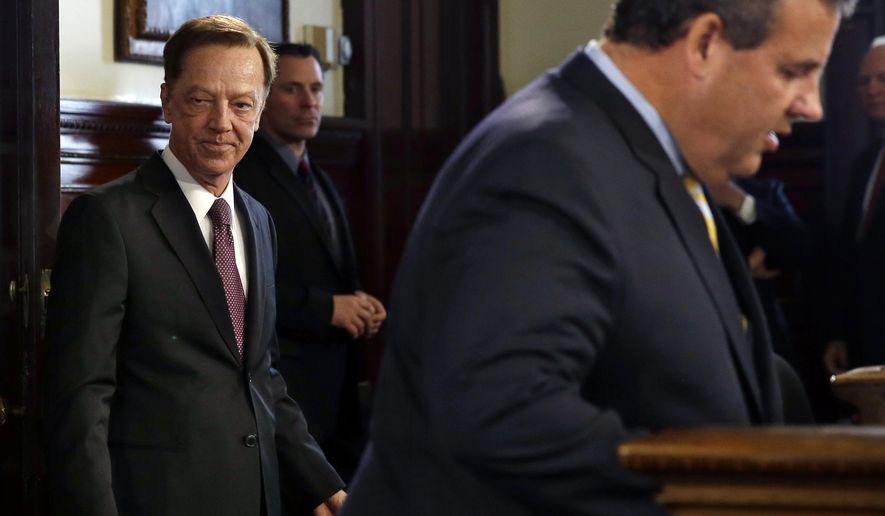 Jamie Fox, left, listens as New Jersey Gov. Chris Christie announces that he has chosen the former top aide to Democratic Gov. Jim McGreevey to be New Jersey's new transportation commissioner Thursday, Sept. 18, 2014, in Trenton, N.J. Fox was transportation commissioner and then chief of staff for McGreevey before being named deputy executive director of the Port Authority of New York and New Jersey. (AP Photo/Mel Evans)