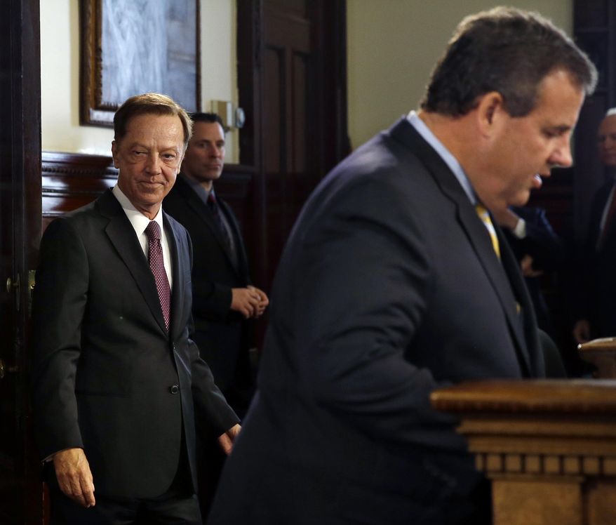 Jamie Fox, left, listens as New Jersey Gov. Chris Christie announces that he has chosen the former top aide to Democratic Gov. Jim McGreevey to be New Jersey's new transportation commissioner Thursday, Sept. 18, 2014, in Trenton, N.J. Fox was transportation commissioner and then chief of staff for McGreevey before being named deputy executive director of the Port Authority of New York and New Jersey. (AP Photo/Mel Evans)
