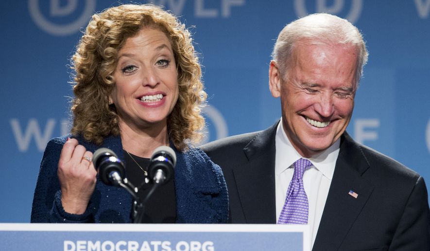 Vice President Joe Biden, right, laughs as he is introduced by DNC Chair Rep. Debbie Wasserman Schultz, D-Fla., at the DNC Women&#x27;s Leadership conference in Washington, Friday, Sept. 19, 2014. (AP Photo/Manuel Balce Ceneta) ** FILE **