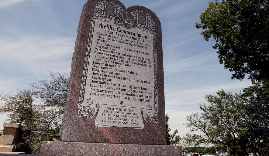 File - This June 20, 2014 file photo is the Ten Commandments monument at the state Capitol in Oklahoma City. The privately funded monument on the grounds of the Oklahoma Capitol does not violate the state constitution and can stay there, an Oklahoma County judge said Friday, Sept. 19, 2014 in a ruling that attorneys who filed the lawsuit in question vowed to appeal to the state Supreme Court. (AP Photo/Sue Ogrocki, File)