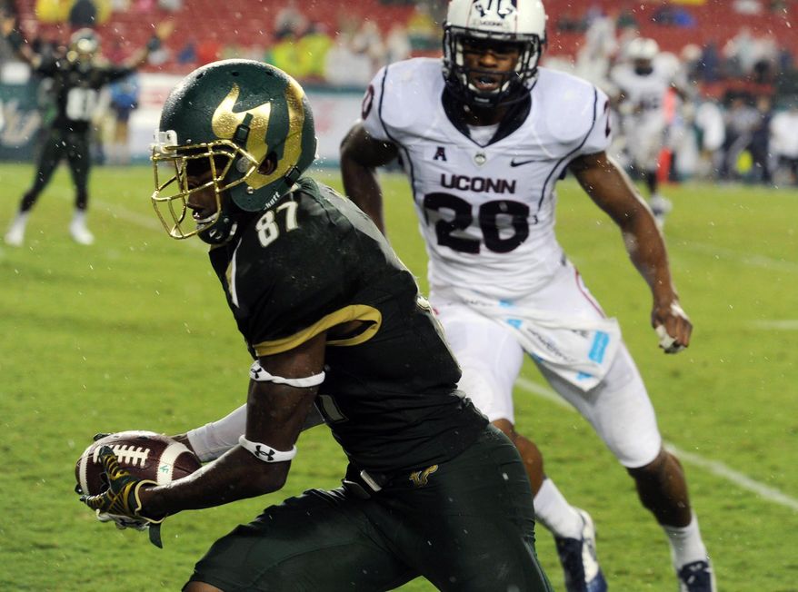 University of South Florida's Rodney Adams (87) heads for a touchdown against UConn, during a football game, Friday, Sept. 19, 2014 at Raymond James Stadium in Tampa, Fla. (AP Photo/Tampa Tribune, Andy Jones) ST. PETERSBURG OUT; LAKELAND OUT; BRADENTON OUT; MAGS OUT; LOCAL TELEVISION OUT; WTSP CH 10 OUT; WFTS CH 28 OUT; WTVT CH 13 OUT; BAYNEWS 9 OUT; THE TAMPA BAY TIMES OUT; LAKELAND LEDGER OUT; BRADENTON HERALD OUT; SARASOTA HERALD-TRIBUNE OUT; WINTER HAVEN NEWS CHIEF OUT