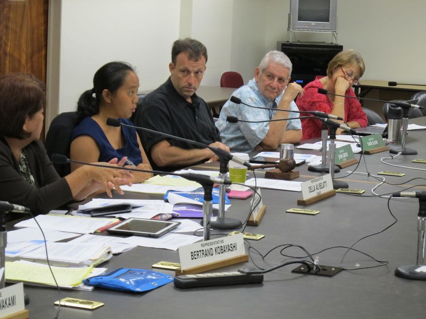 Rep. Dee Morikawa from left, Rep. Della Au Bellati, Sen. Josh Green, Sen. Sam Slom and Sen. Rosalyn Baker listen to testimony about financial problems in public hospitals at the Legislature, Friday, Sept. 19, 2014, in Honolulu. Public hospitals across Hawaii are finding ways to reduce staff and cut services because they don't have enough money to make ends meet. (AP Photo/Cathy Bussewitz)