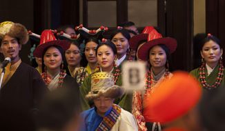 Exile Tibetans perform a religious song during an inter-faith meeting in New Delhi, India, Saturday, Sept. 20, 2014. The Dalai Lama brought religious leaders together Saturday to mull some of India&#x27;s most pressing problems, from gender violence to widespread poverty, while praising the country&#x27;s religious harmony as proof to the world that different communities can live peacefully together. (AP Photo/Tsering Topgyal)