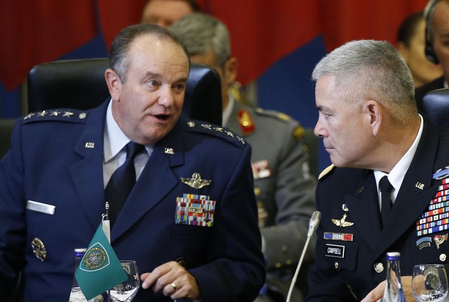 NATO's Supreme Allied Commander, Europe or SACEUR, U.S. Gen. Philip M. Breedlove, left , and U.S. Army Commander for International Security Assistance Forces (ISAF), Gen. John F. Campbell attend on NATO Military Committee Conference in Vilnius, Lithuania, Saturday, Sept. 20, 2014. (AP Photo/Mindaugas Kulbis)