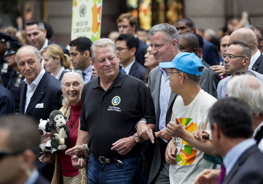 From left, French Foreign Minister Laurent Fabius, primatologist Jane Goodall, former U.S. Vice President Al Gore, New York Mayor Bill de Blasio, and U.N. Secretary General Ban Ki-moon participate in the People's Climate March in New York Sunday, Sept. 21, 2014. Thousands of demonstrators filled the streets of Manhattan on Sunday, accompanied by drumbeats, wearing costumes and carrying signs as they urged policy makers to take global action on climate change. (AP Photo/Craig Ruttle)