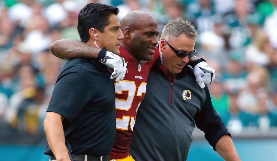 Washington Redskins&#39; DeAngelo Hall is helped off the field after an injury during the second half of an NFL football game against the Philadelphia Eagles, Sunday, Sept. 21, 2014, in Philadelphia. (AP Photo/Matt Rourke)