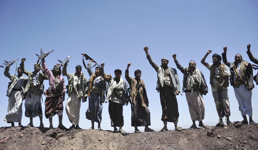 Hawthi Shiite rebels chant slogans at the compound of the army&#39;s First Armored Division, after they took it over, in Sanaa, Yemen, Monday, Sept. 22, 2014. Heavily armed Yemeni Shiite militiamen took over the headquarters and house of a powerful army general allied to Sunni Islamists on Monday and set up checkpoints across the capital, Sanaa, after sweeping across the city as the general and his allies fled and went into hiding. (AP Photo/Hani Mohammed)