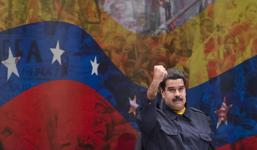 Nicolas Maduro, President of Venezuela, gestures to the crowd before he speaks at Hostos Community College as the United Nations General Assembly convenes, Tuesday, Sept. 23, 2014, in the Bronx borough of New York. (AP Photo/John Minchillo)