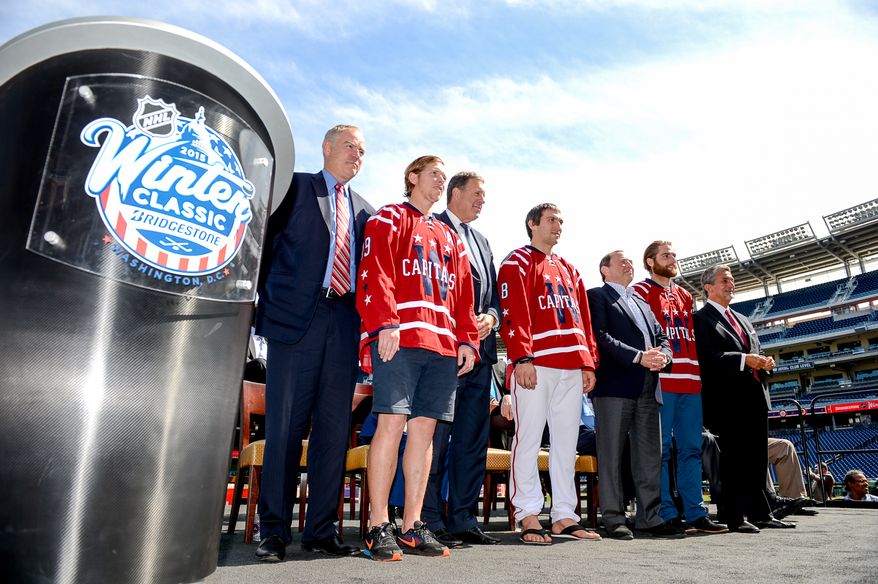 Left to right: Washington Capitals Senior Vice President and General Manager Brian MacLellan, Center Nicklas Backstrom,  Monumental Sports &amp; EntertainmentPresident Dick Patrick, Washington Capitals Captain Alex Ovechkin, NHL Commissioner Gary Bettman, Goaltender Braden Holtby, and Washington Capitals Chairman &amp; Owner Ted Leonsis pose for photographs for the 2015 Bridgestone NHL Winter Classic held at Nationals Park, Washington, D.C., Tuesday, September 23, 2014. (Andrew Harnik/The Washington Times)