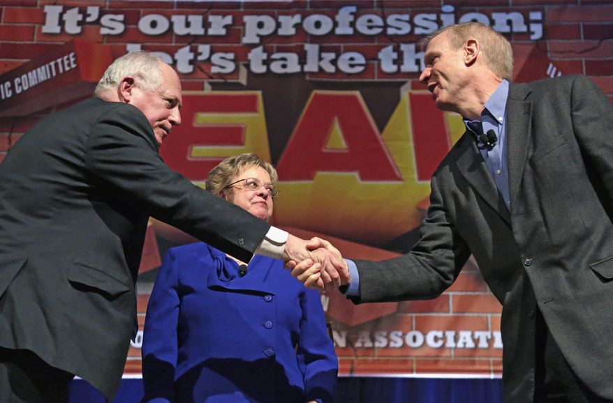 FILE - In this April 11, 2014 file photo, Illinois Gov. Pat Quinn, left, and his Republican rival, businessman Bruce Rauner, shake hands after they appeared together at the annual meeting of the Illinois Education Association in Chicago. Illinois has seen a roughly 30 percent increase in the number of TV ads and the money spent to air them this election cycle compared to four years ago, according to an analysis by the non-partisan Center for Public Integrity. That jump has been fueled by the neck-and-neck race between Rauner and Quinn. (AP Photo/M. Spencer Green, File)