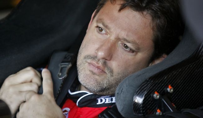 FILE - In this Oct. 29, 2010, file photo, NASCAR driver Tony Stewart sits in his car during practice for the NASCAR Sprint Cup series auto race at the Talladega Superspeedway in Talladega, Ala.  A grand jury will decide whether Stewart will be charged in the August death of fellow driver Kevin Ward at a sprint car race in upstate New York, Ontario County District Attorney Michael Tantillo announced Tuesday, Sept. 16, 2014. Ward, 20, died after being struck by Stewart&#x27;s car. Ward had climbed out of his car and walked onto the dirt track to confront Stewart after he spun out while the two raced side by side. (AP Photo/Glenn Smith, File)