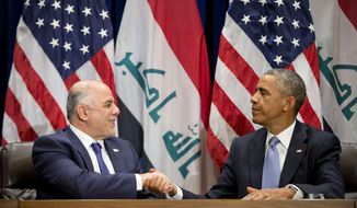 President Obama shakes hands with Iraqi Prime Minister Haider al-Abadi following their bilateral meeting at U.N. headquarters, Wednesday, Sept. 24, 2014. (AP Photo/Pablo Martinez Monsivais)