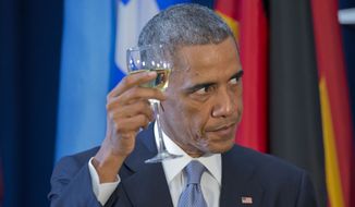 President Obama raises his glass to toast during a luncheon hosted by U.N. Secretary General Ban Ki-moon on Sept. 24, 2014, at the United Nations headquarters. (Associated Press) **FILE**