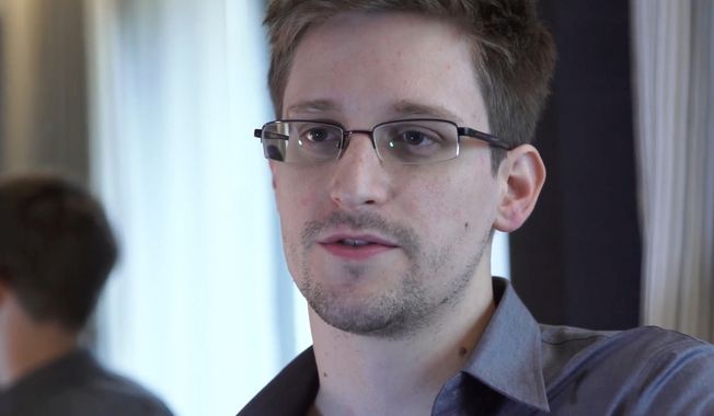 In this June 9, 2013, file photo provided by The Guardian Newspaper in London shows Edward Snowden, who worked as a contract employee at the National Security Agency, in Hong Kong. (AP Photo/The Guardian, Glenn Greenwald and Laura Poitras, File)