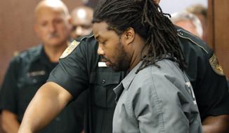 Jesse Leroy Matthew Jr. is escorted into a courtroom for an appearance before 405th District Court Judge Michelle Slaughter regarding his extradition back to Virginia, Thursday, Sept. 25, 2014, in Galveston, Texas. Matthew was arrested on a beach in the Texas community of Gilchrist by Galveston County Sheriff&#39;s authorities Wednesday night, Sept. 24, 2014. He is charged with abducting missing University of Virginia sophomore Hannah Graham and is awaiting extradition. (AP Photo/David J. Phillip)